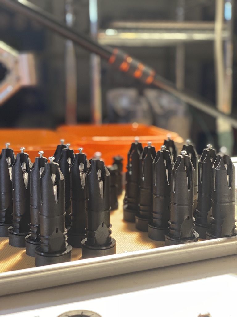 A tray of freshly printed black Prime emulators
